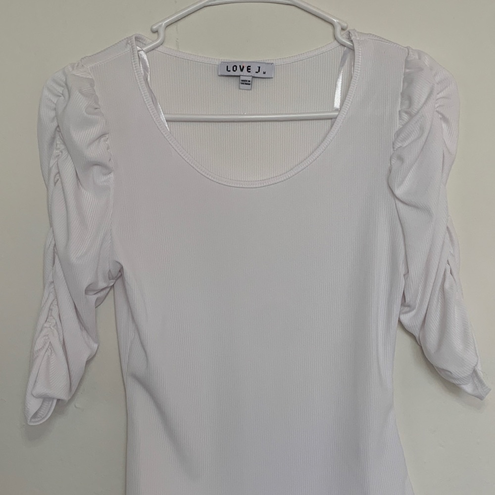 white bikini top with ruffled sleeves